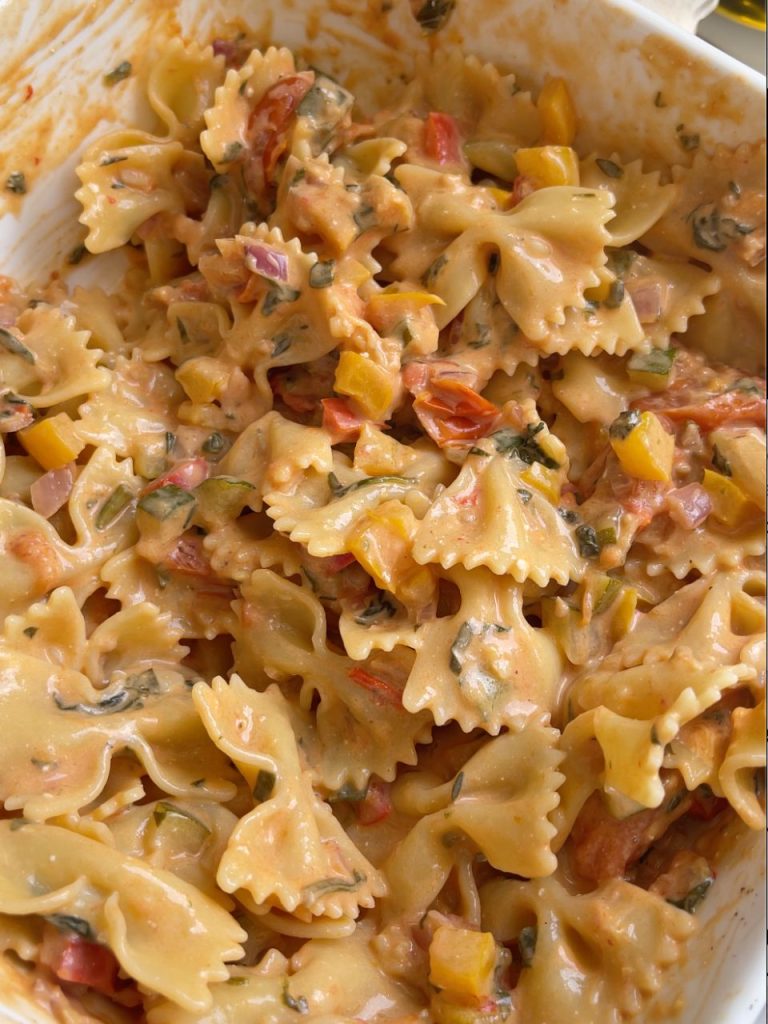 Cooked farfalle mixed into the creamy vegetable mixture
